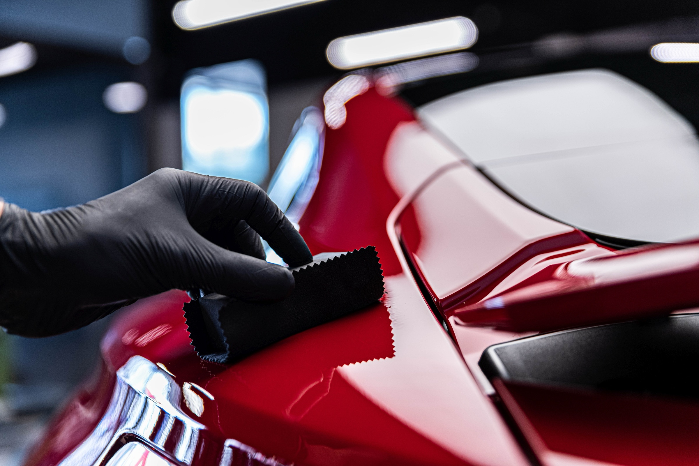 Ceramic coating being applied to a car