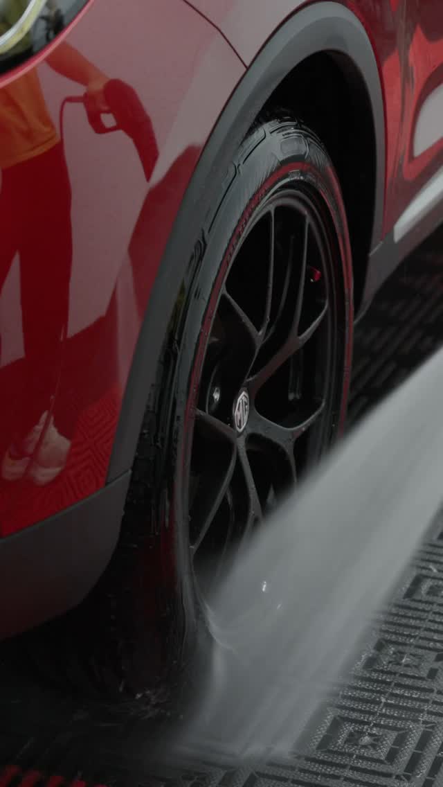 Wheel and tyre being rinsed by hand at Nitro