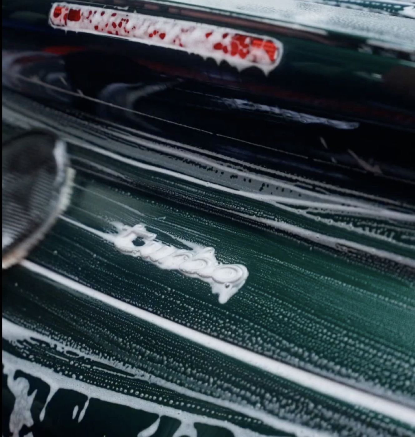 Porsche Turbo being hand washed with foam